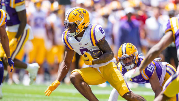 LSU Tigers running back Malik Nabers carries the ball.